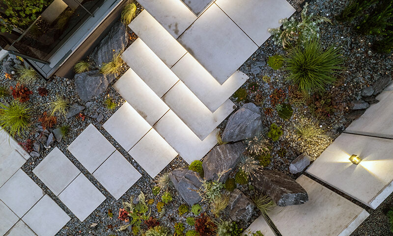 Modern Decorative Backyard Rockery Garden Stairs Illuminated by Garden LED Lighting.